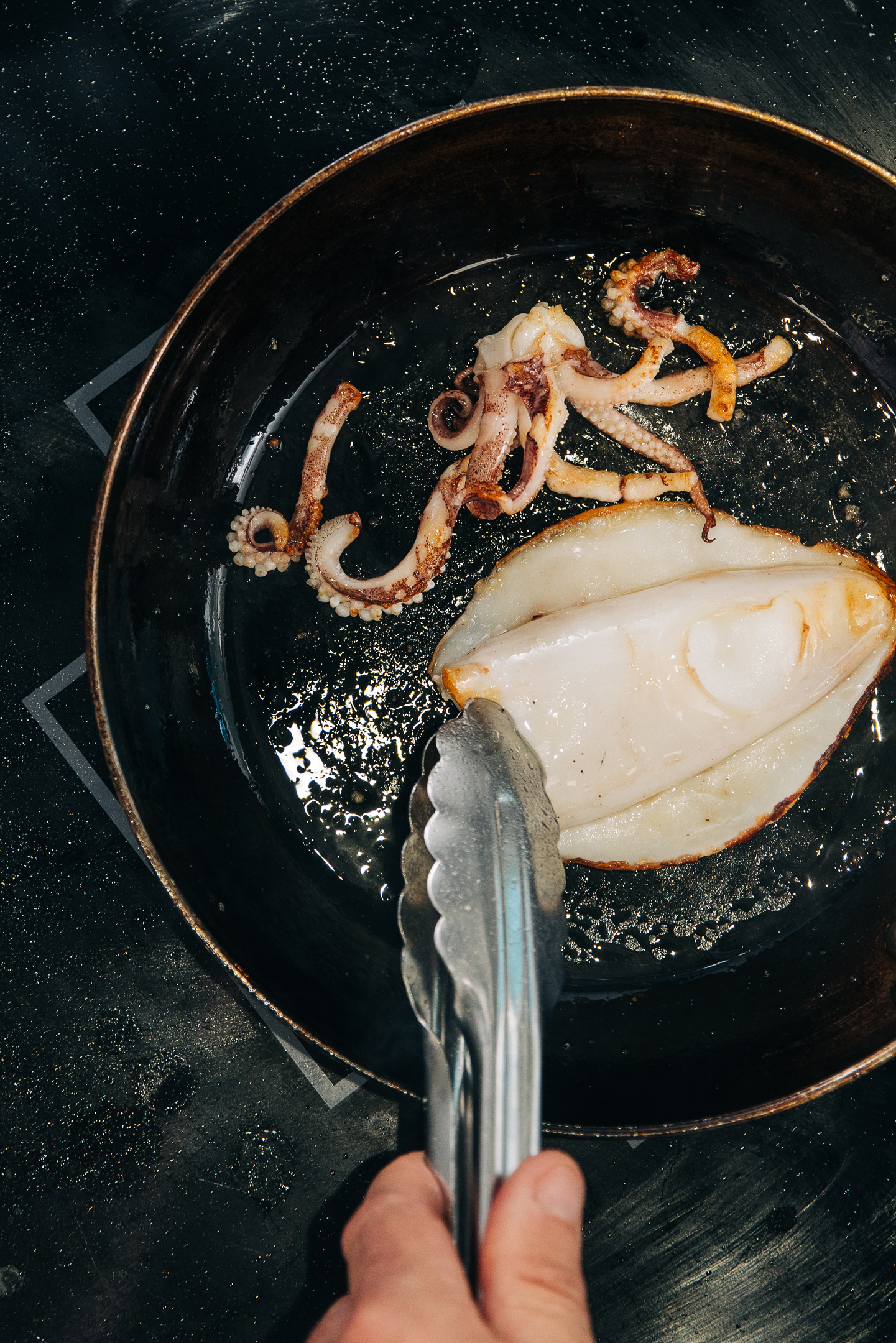Cooking Seafood Fresh seafood being cooked in a pan at Samphire Restaurant, Rumi on Louth