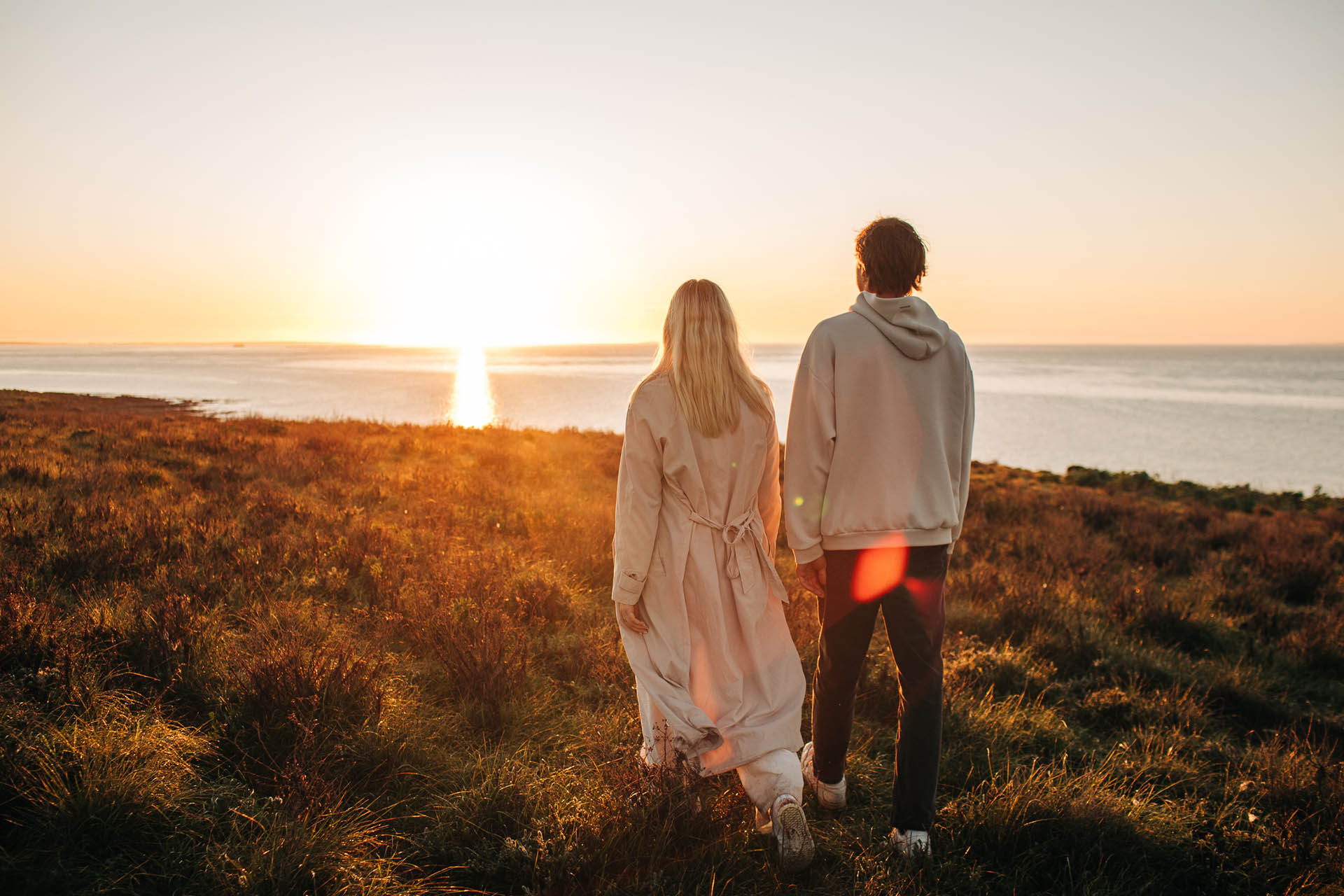 Private-Island-Louth-20240814_Rumi_On_Louth_Louth_Island_358 (1) Romantic couple walking along rugged coastline at Rumi on Louth during sunset