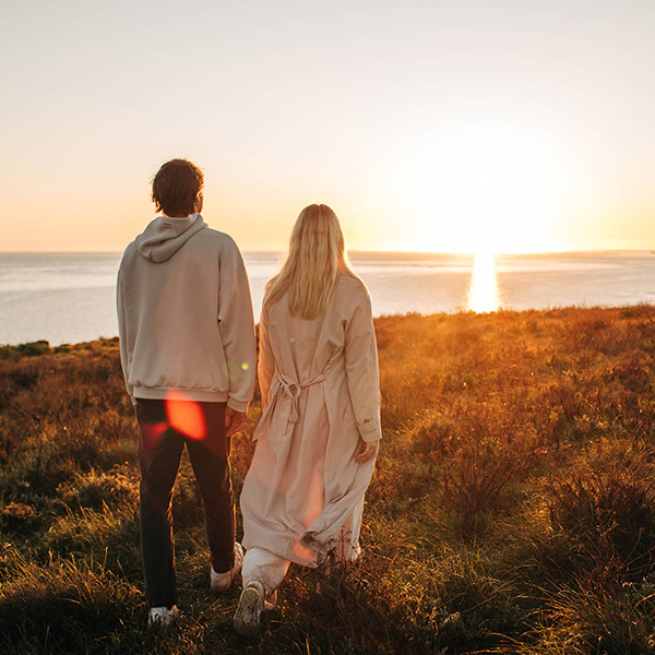 Couple walking together outdoors on Rumi on Louth private island retreat, South Australia, surrounded by natural landscape and coastal scenery