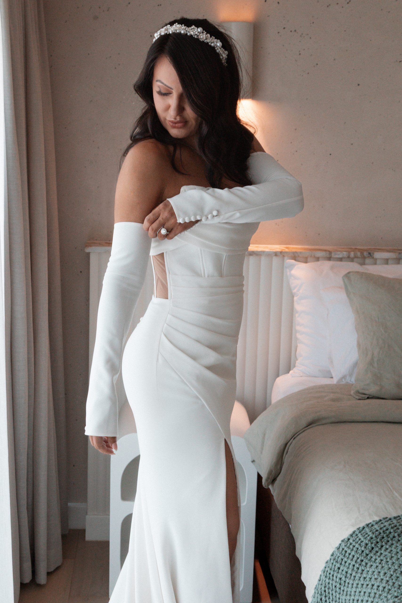 Che & Natasha Rumi on Louth Bride in elegant white gown getting ready at Rumi on Louth private island wedding venue
