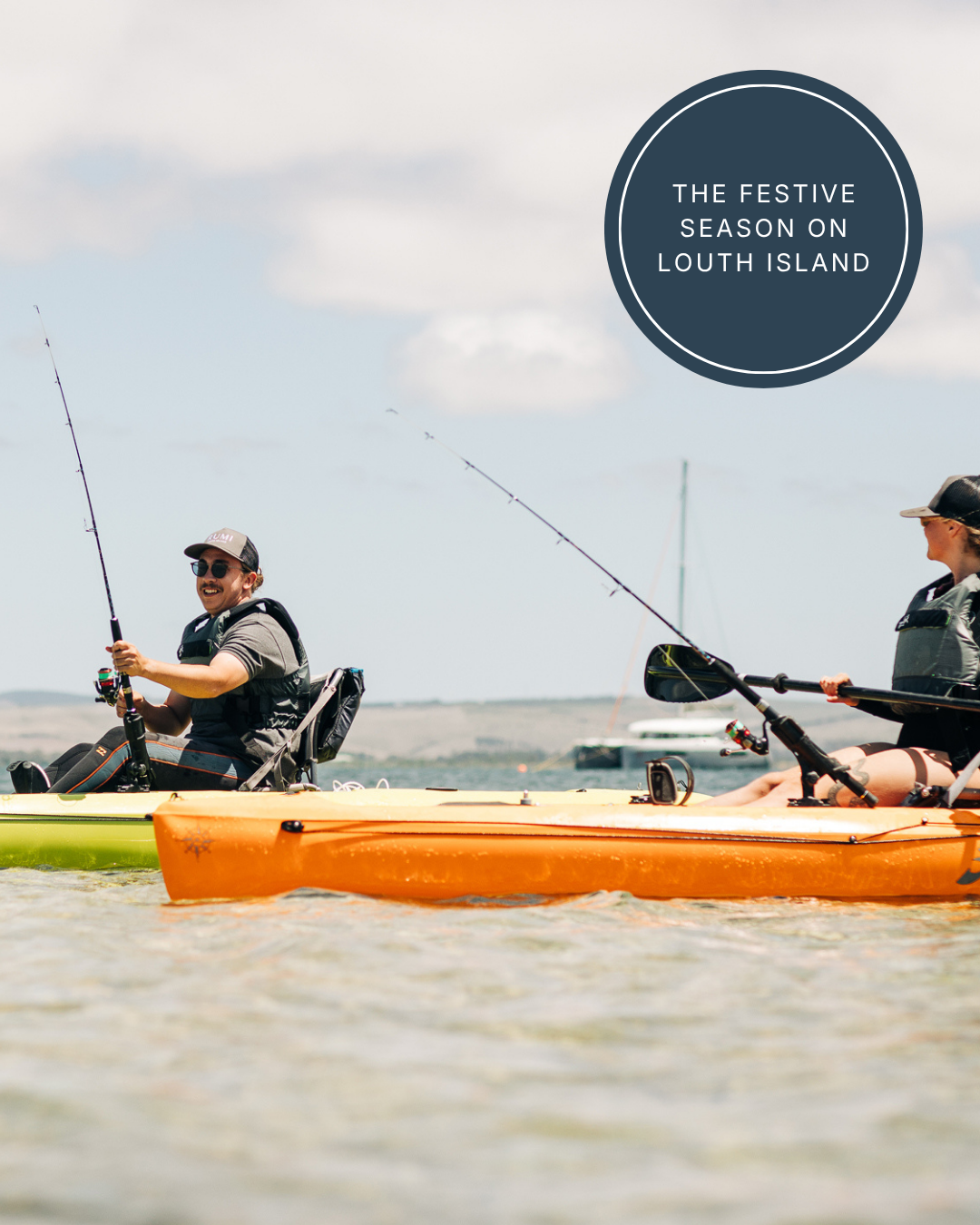 Two guests kayaking and fishing on calm waters under blue skies during a summer stay at Rumi on Louth