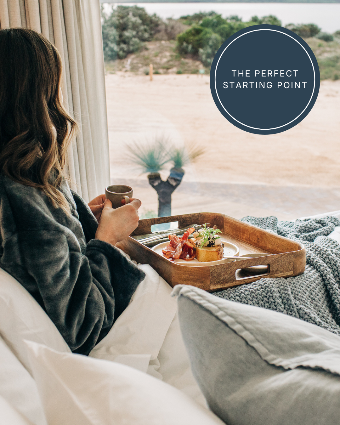 Woman enjoying breakfast in bed with ocean views at Rumi’s island accommodation