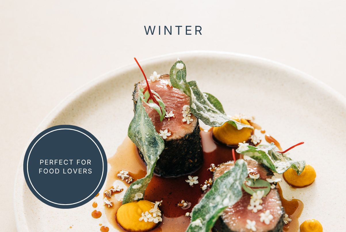 Gourmet prawn dish served on rustic plate, showcasing local winter cuisine on Louth Island